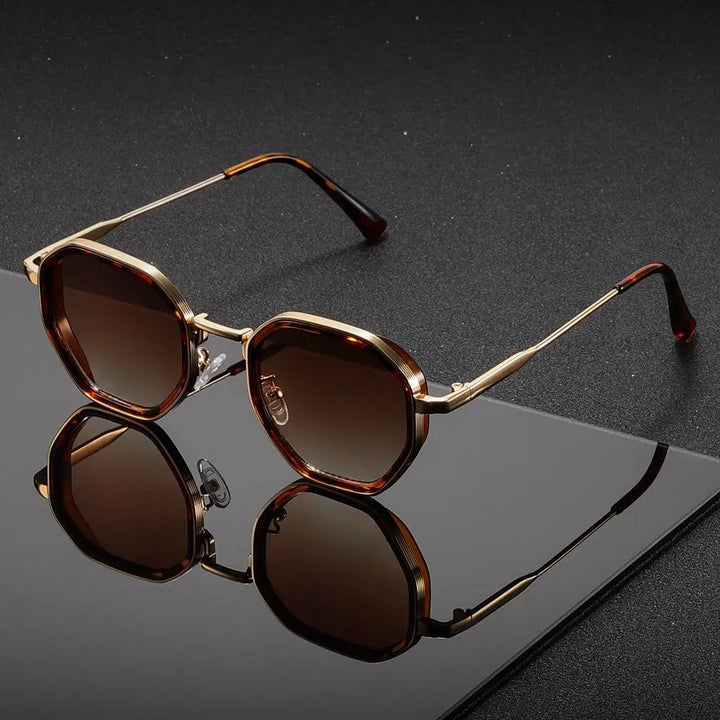 Unisex geometric tortoiseshell sunglasses with gradient lenses for stylish sun protection.