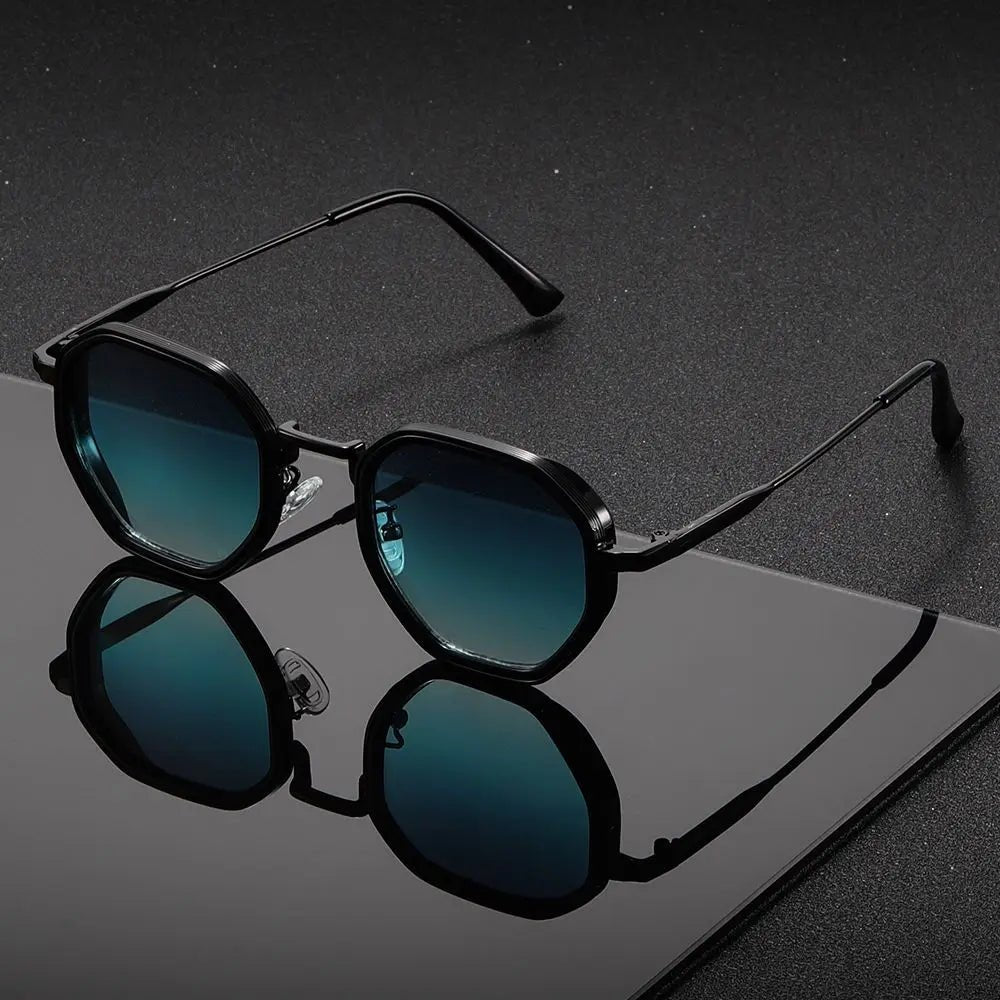Lightweight geometric tortoiseshell frame sunglasses with gradient lenses. Modern unisex design for sun protection.