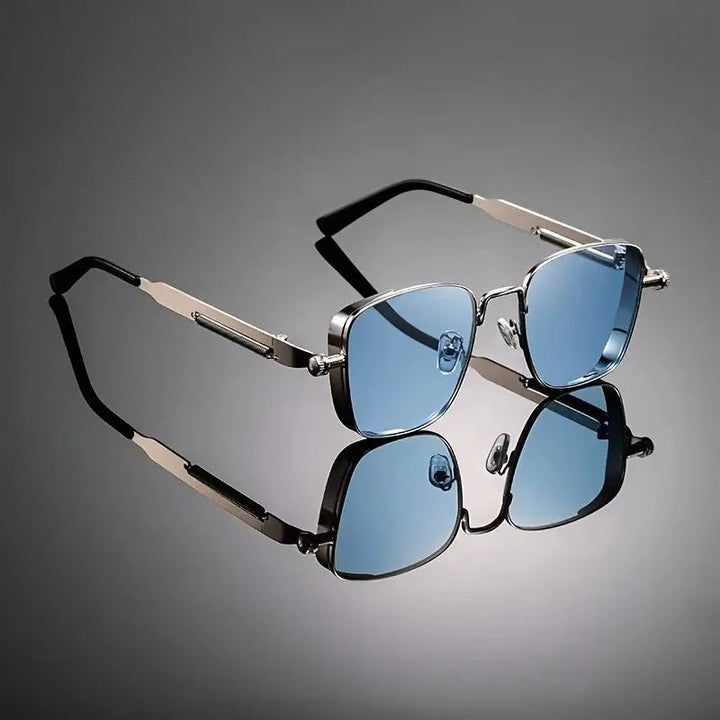 Modern unisex sunglasses featuring a lightweight metal frame & stylish gradient lenses. Minimalist design.