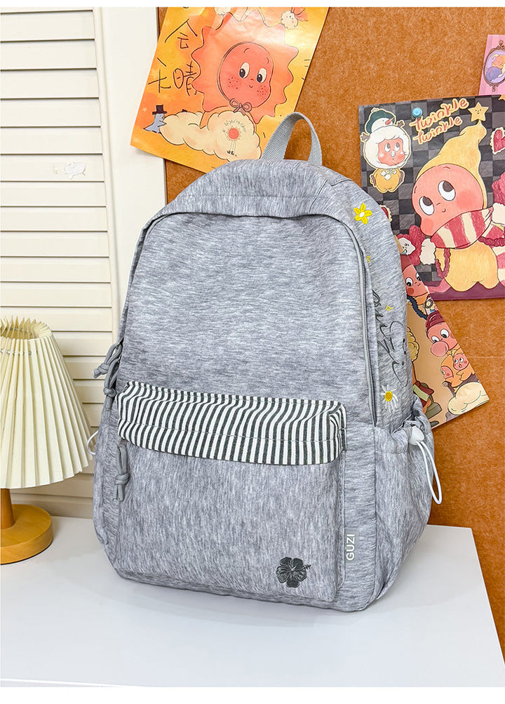 Gray unisex casual backpack, cotton-blend for everyday use. Perfect for school, work, or travel. Durable & stylish.