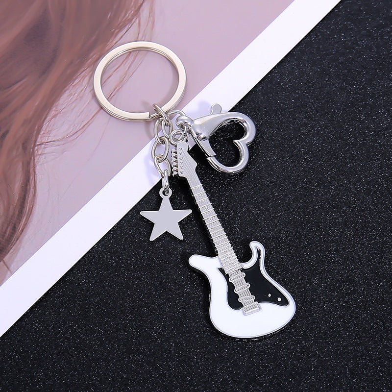 Durable metal guitar keychain for rock music fans, a unique and sturdy key holder.