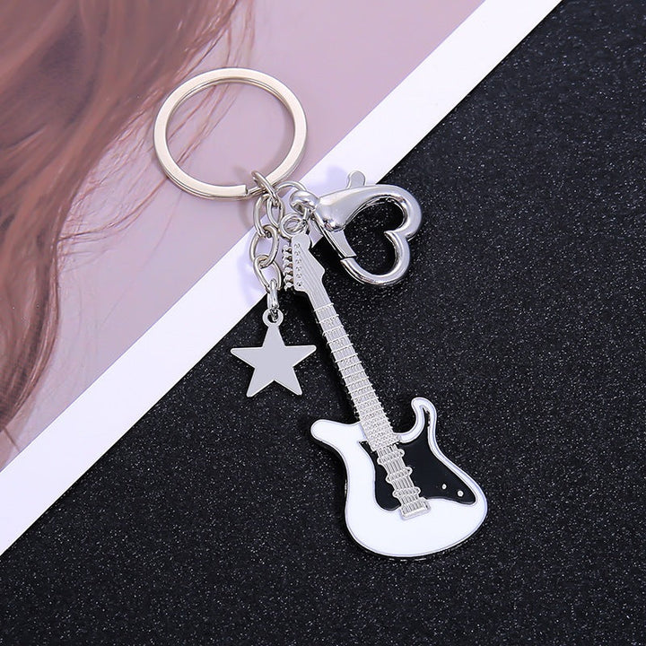 Durable metal guitar keychain for rock music fans, a unique and sturdy key holder.