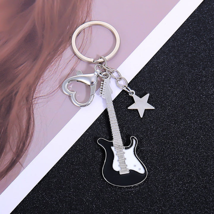 Classic guitar design keychain, perfect musical gift for any music lover or enthusiast.