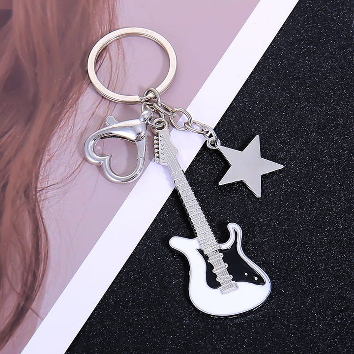 Elegant metal guitar gift keychain, a premium musical accessory for him or her.
