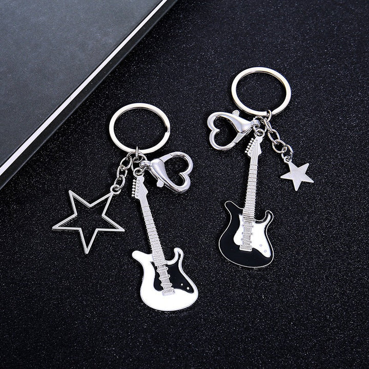 Detailed metal guitar design keychain, unique music accessory for keys, bags & backpacks.