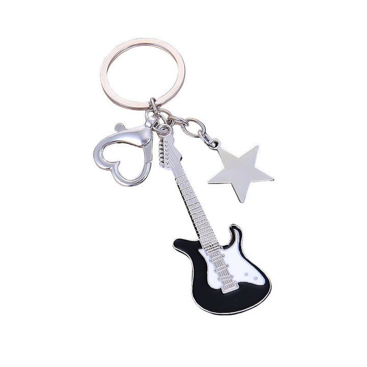 Sleek metal guitar shaped key holder, a durable & unique music accessory for daily use.