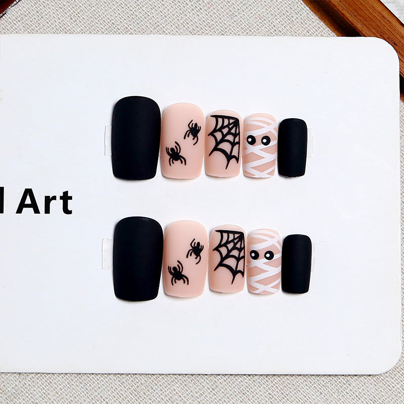 Festive Halloween temporary nails, a unisex spooky costume accessory for holiday parties & fun nail art.