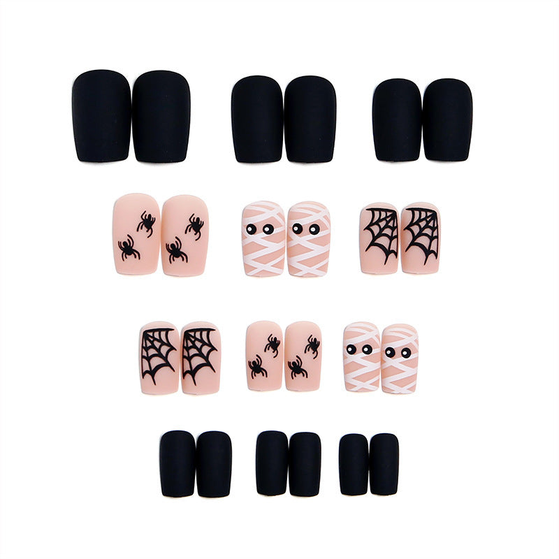 Complete Halloween nail art kit with spooky and festive press-on nails for a quick, fun, unisex holiday look.