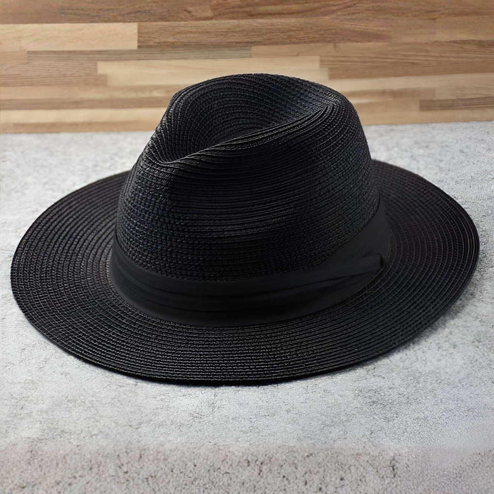 Stylish unisex Panama hat, natural straw, wide brim, ideal for beach, summer travel, and vacation sun protection.