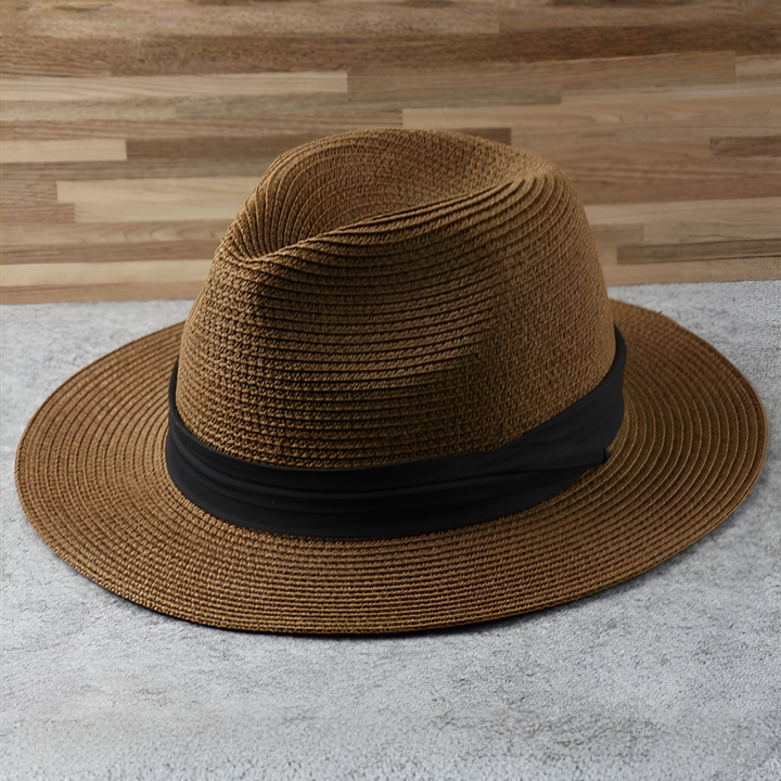 Lightweight natural toquilla straw Panama hat, wide brim, handcrafted unisex design, offering stylish sun protection.