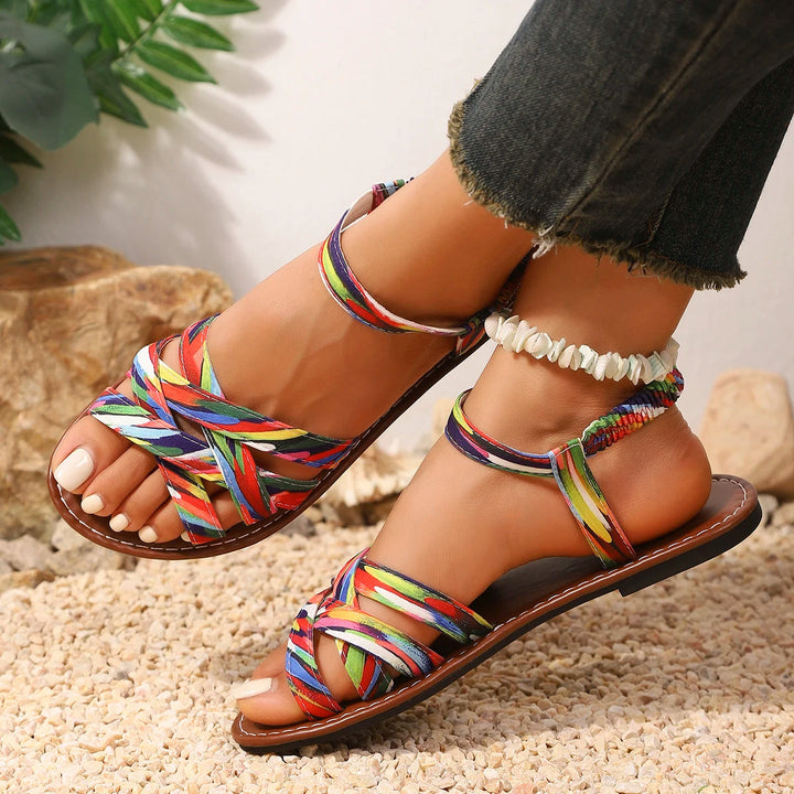 Unisex handmade beachwear sandals by the ocean, offering stylish comfort for summer adventures & casual outfits.