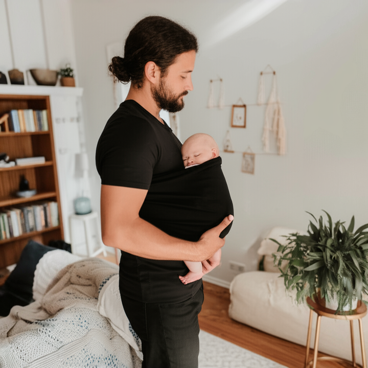 Comfortable unisex parent shirt with integrated hands-free baby carrier pouch for easy infant carrying.