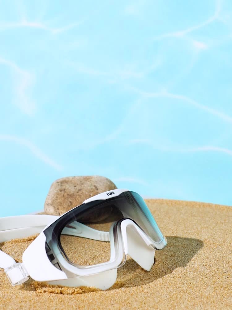 Sleek unisex HD swimming goggles, anti-fog coated lenses, and secure leak-proof design for swimmers.