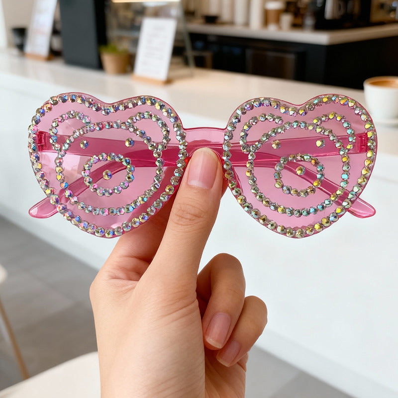 Fashionable heart rhinestone sunglasses with UV protection, a glamorous unisex accessory.