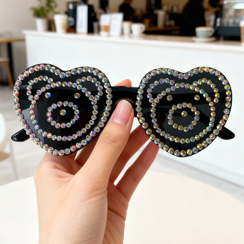Fun heart-shaped rhinestone sunglasses, a colorful statement eyewear for summer events.