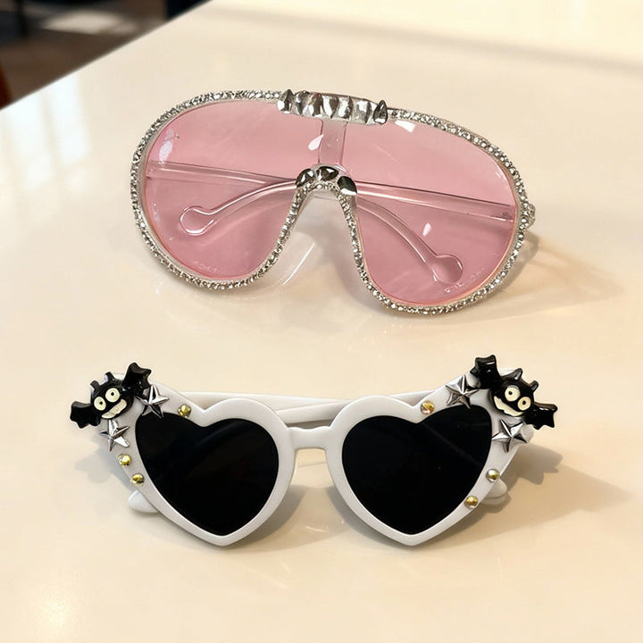 Unisex heart-shaped fun sunglasses, offering stylish UV protection. Perfect novelty eyewear for any occasion.