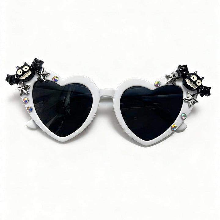 Fashionable heart sunglasses with UV protection. Fun pink eyewear for festivals, parties & unique style.