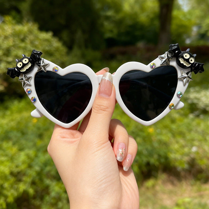 Halloween heart glasses for costumes & fun. Unisex novelty eyewear, offering UV protection and a bold look.