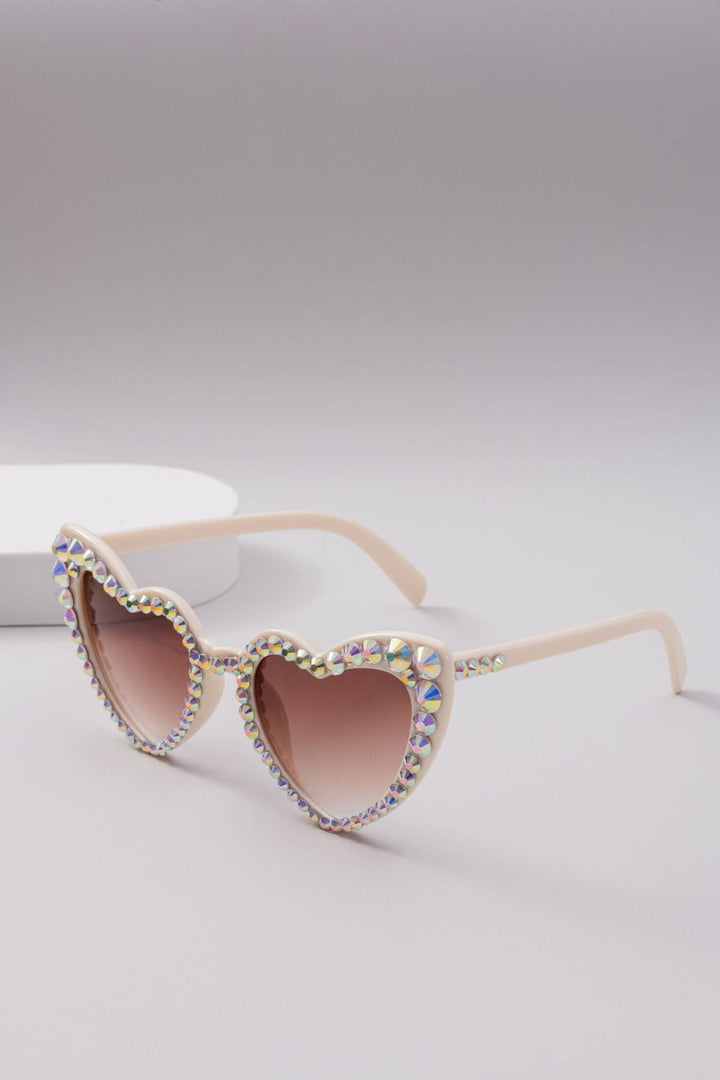 Trendy heart rhinestone sunglasses, offering glamorous UV protection and chic style.