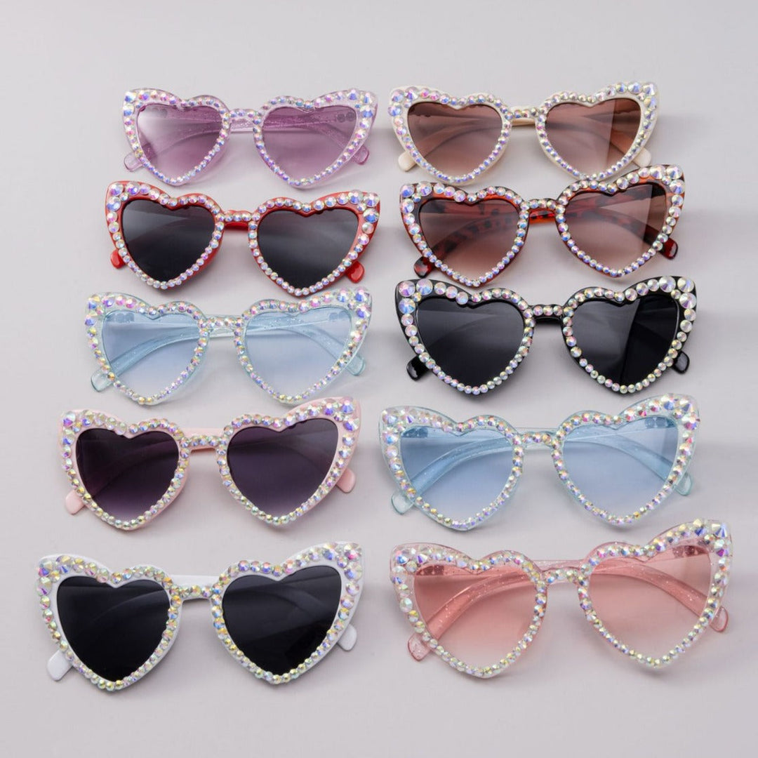 Eye-catching unisex heart sunglasses adorned with sparkling rhinestones. Trendy shades.