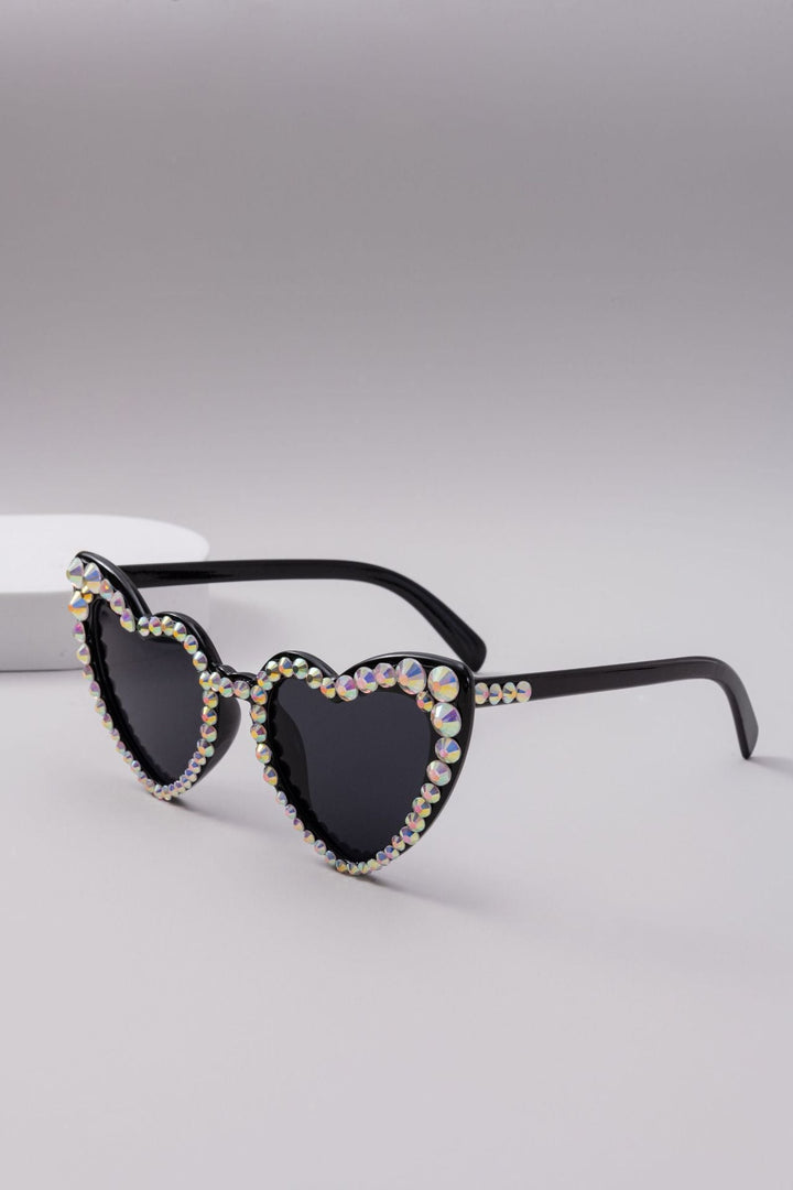 Unisex heart sunglasses with shimmering rhinestones, perfect for any fashion lover.