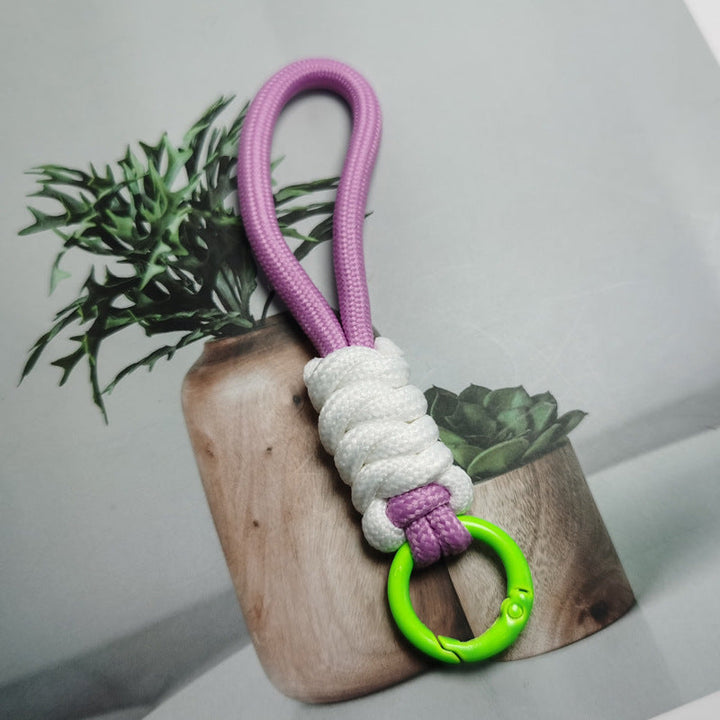 Multi-purpose paracord keychain, essential key holder for outdoor enthusiasts.