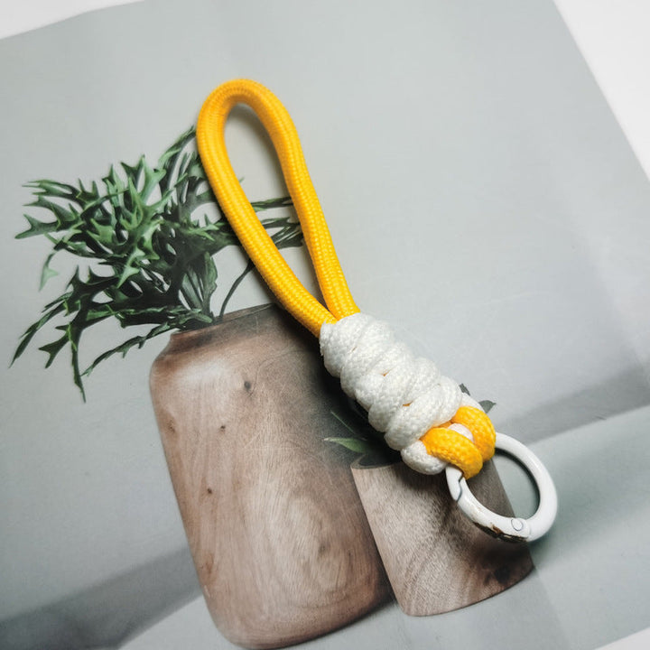 Compact black paracord keychain for outdoor gear, durable EDC key organizer.