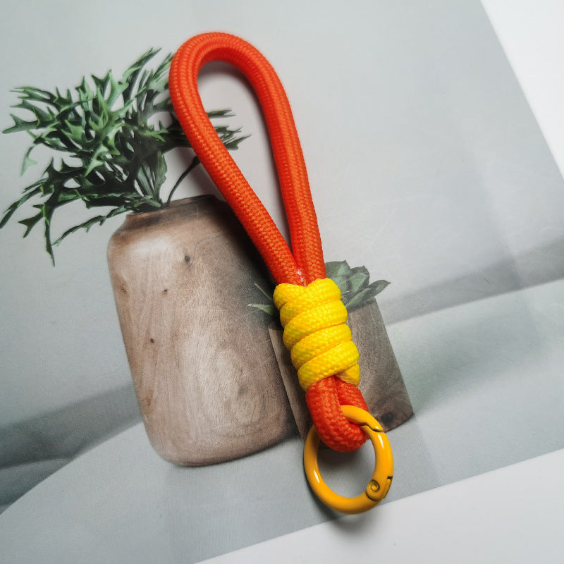 Unisex outdoor gear paracord keychain, tough and functional key holder.
