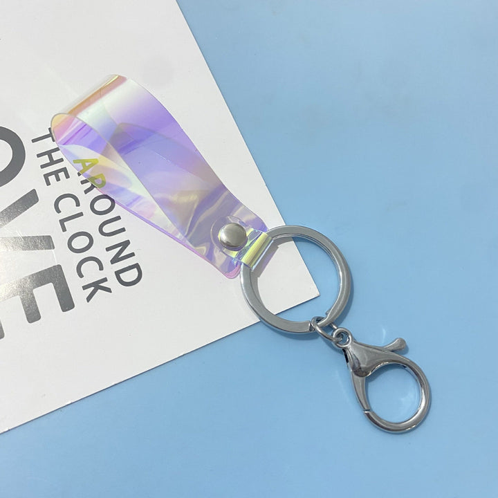 Stylish holographic shimmer keychain, a modern unisex bag charm accessory for any look.