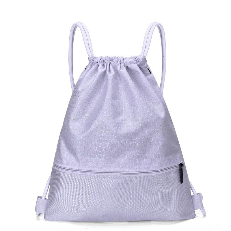 Heavy-duty honeycomb drawstring backpack, built for resilience during travel and outdoor activities.