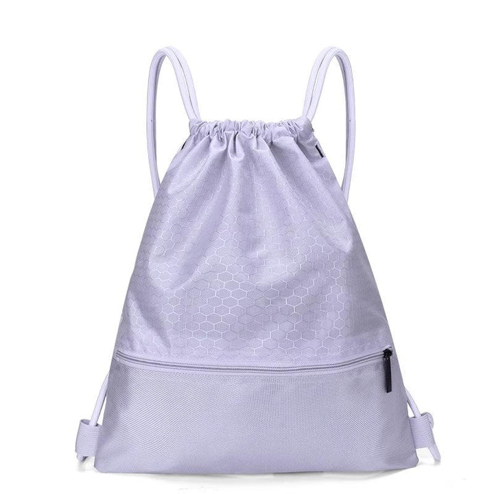 Heavy-duty honeycomb drawstring backpack, built for resilience during travel and outdoor activities.