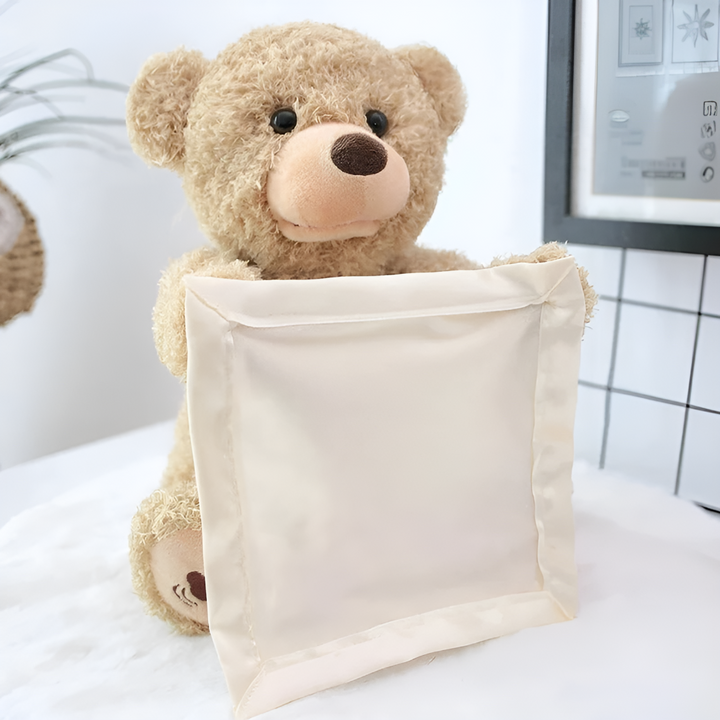 Soft cuddly unisex plush teddy bear with peek-a-boo interactive feature, an ideal gift for babies & toddlers.