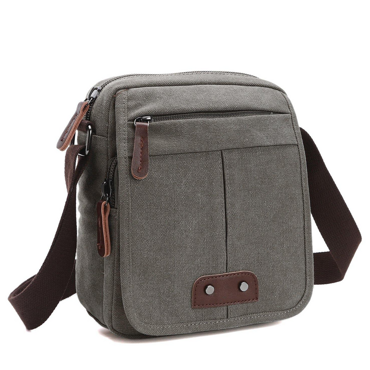 Durable brown canvas shoulder bag. Unisex crossbody for everyday carry, travel, and keeping items organized.