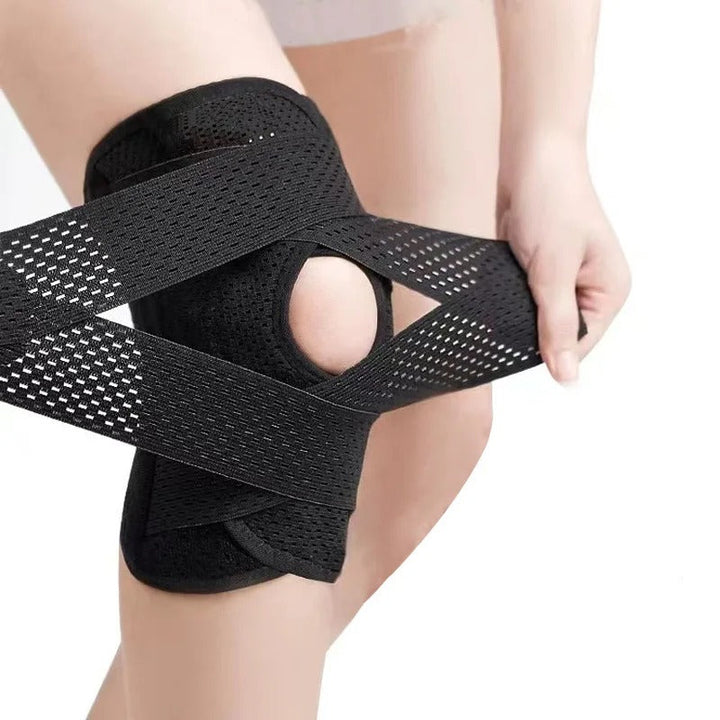 Black unisex knee support sleeve, ideal for athletes, offering compression, spring support & knee protection.