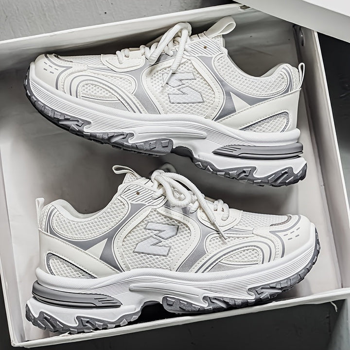Stylish low-top unisex trainers with laces, ideal for street style & casual wear.