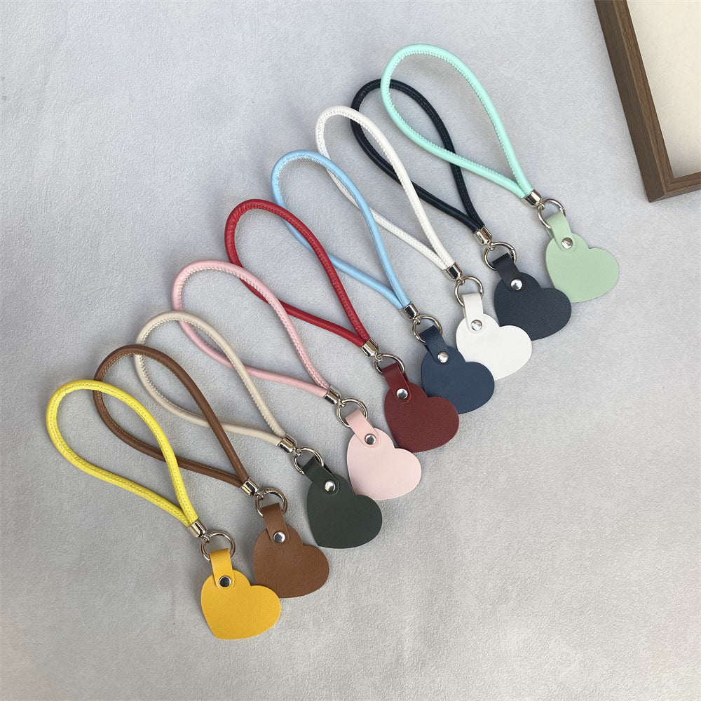 Simple, elegant leather heart keychain, a timeless fashion accessory.