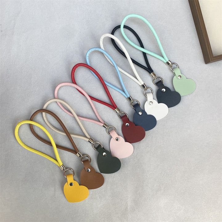Simple, elegant leather heart keychain, a timeless fashion accessory.