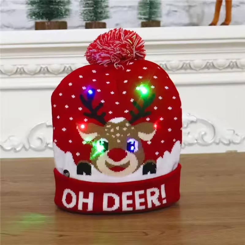 Festive LED knit Christmas beanie hat. Unisex design with pompom, ideal as a light-up winter accessory for holidays.