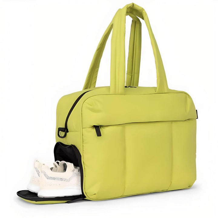 Stylish unisex puffer duffle bag for gym, travel, or weekend getaways. Lightweight, quilted, and features a shoulder strap.
