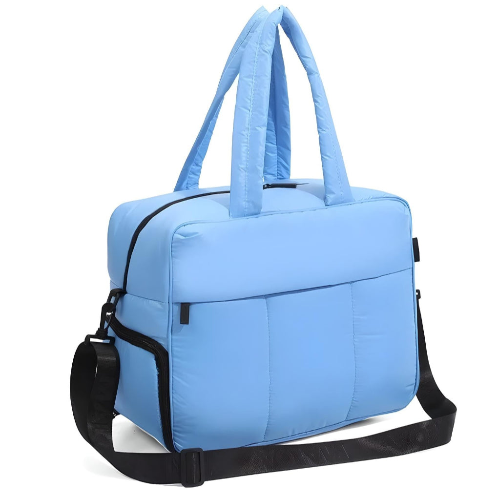 Quilted lightweight puffer duffle bag, ideal for men & women. Versatile as a travel, gym, or stylish carry-on shoulder bag.