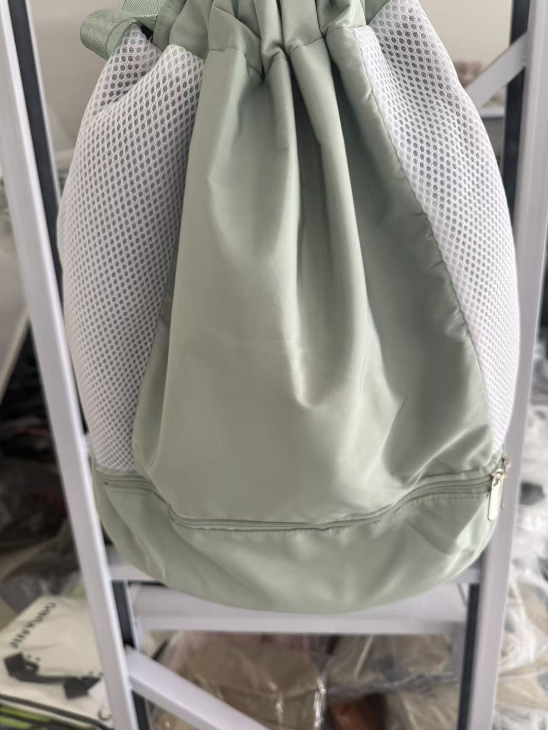 Simple black mesh gym sack, a versatile drawstring backpack for all your activities.