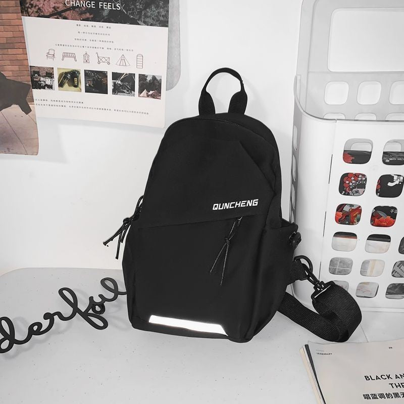 Stylish dark grey unisex lightweight backpack for urban commuters, featuring comfortable straps & ample daily storage.