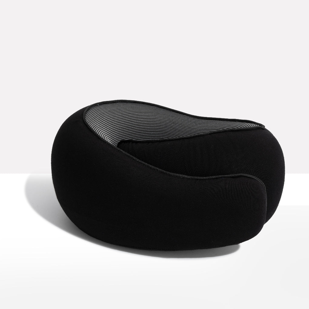Unisex memory foam neck pillow for comfortable airplane & car travel. Ergonomic design provides sleep support.