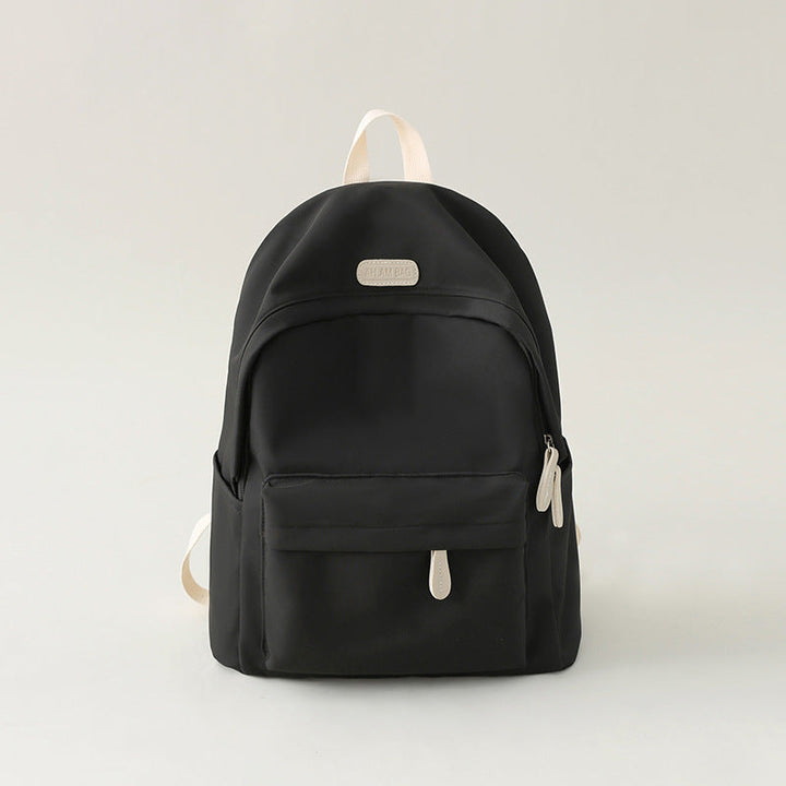Unisex minimalist black backpack, stylish and durable for everyday use, work, school, or travel.