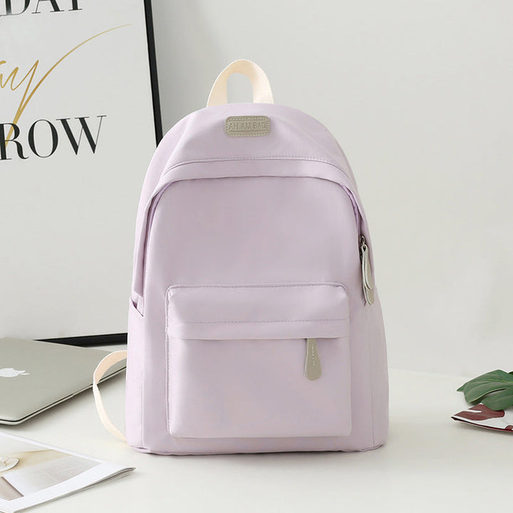 Durable black minimalist backpack, ideal for daily essentials, featuring a modern design for all genders.
