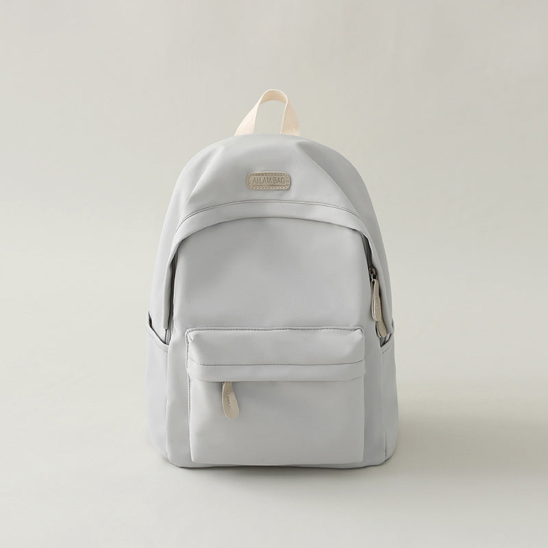 Comfortable shoulder straps on a black minimalist everyday backpack, designed for ergonomic support and durability.