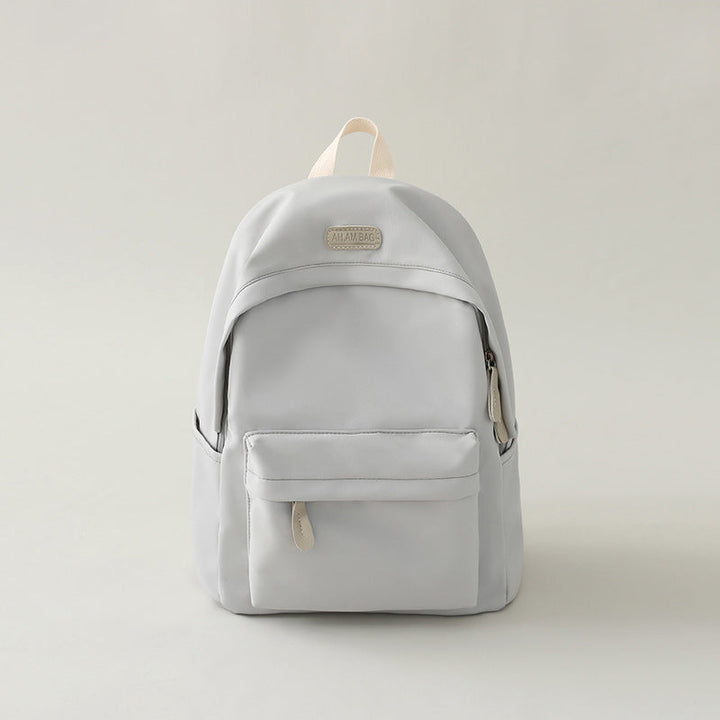 Comfortable shoulder straps on a black minimalist everyday backpack, designed for ergonomic support and durability.