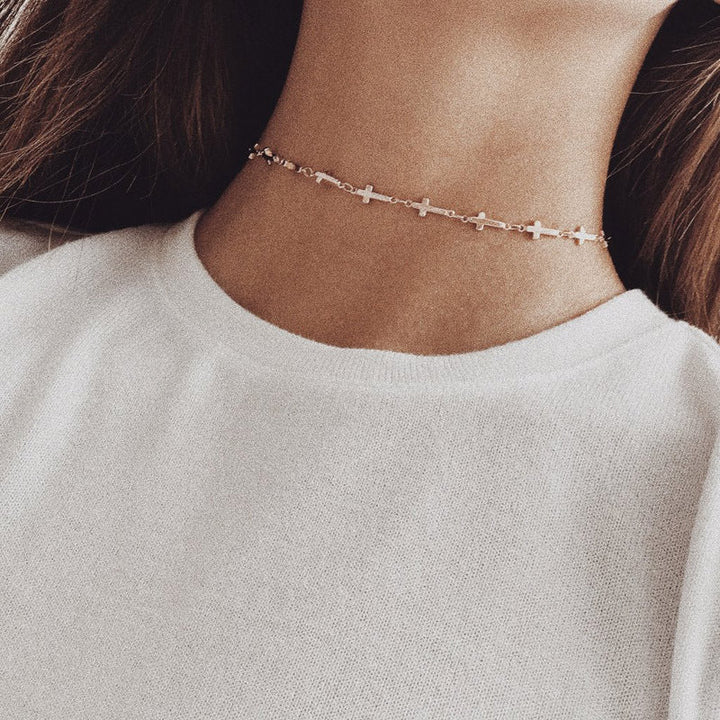 Sleek stainless steel cross chain necklace. Minimalist unisex design, perfect faith jewelry for daily wear.