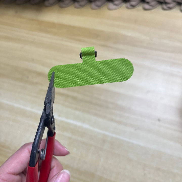 Minimalist key holder, fabric construction for efficient key organization.