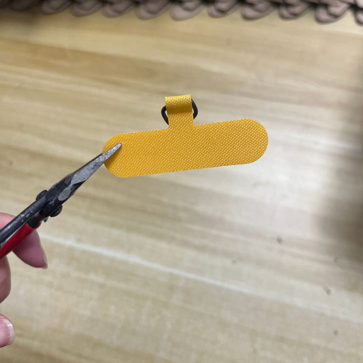 Minimalist fabric key holder, compact design for efficient everyday carry.